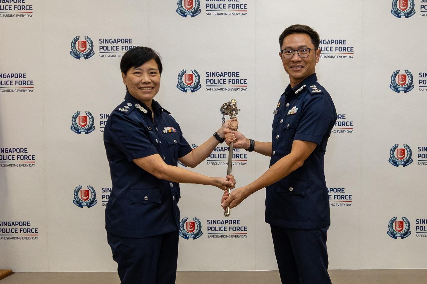 SAC Serene Chiu handing over the symbol of command to Commissioner of Police How Kwang Hwee during the change of command ceremony on June 4.