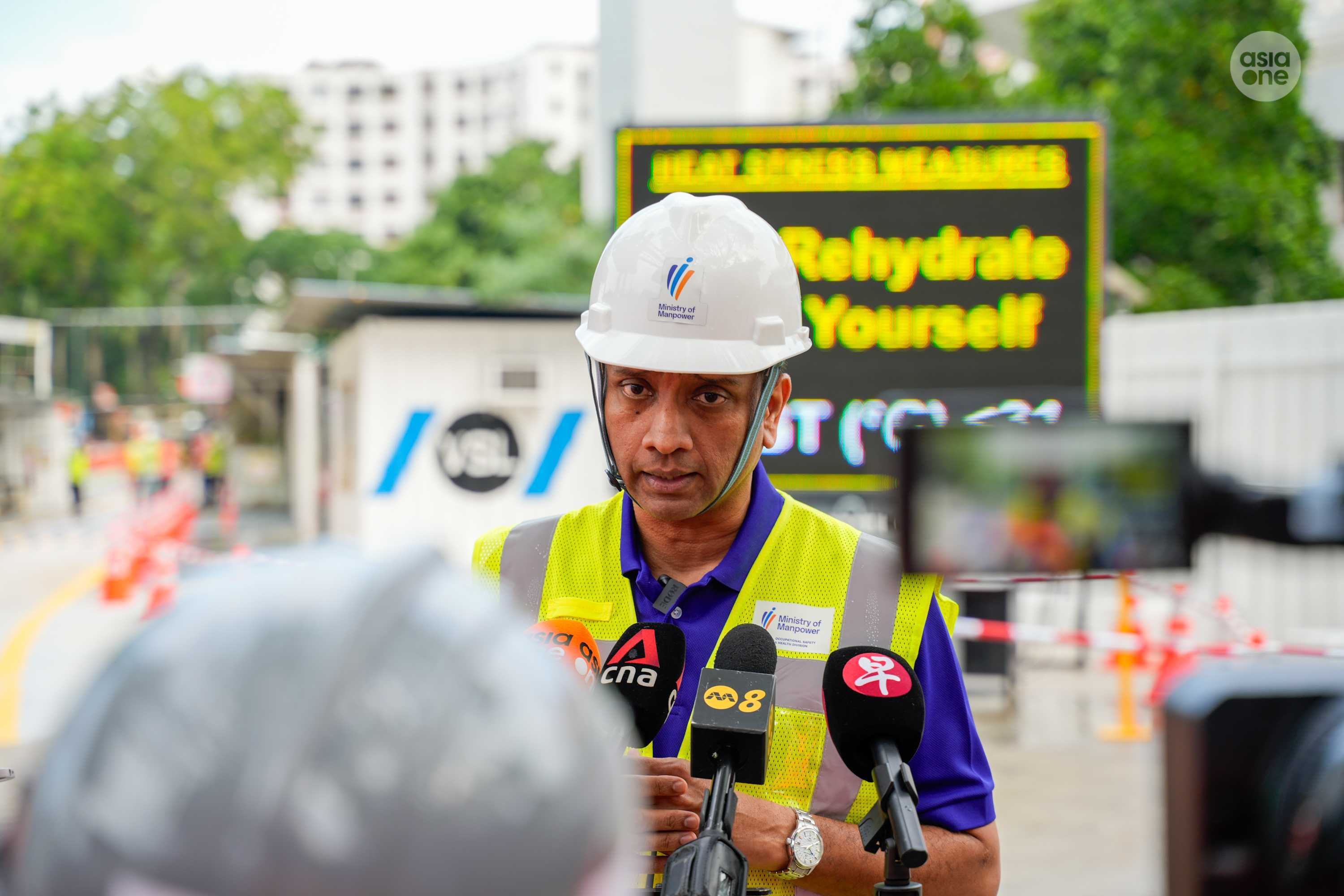 Minister of State for Manpower Dinesh Vasu Dash speaking to the media during his visit to a LTA worksite in Tampines on Monday (May 11).