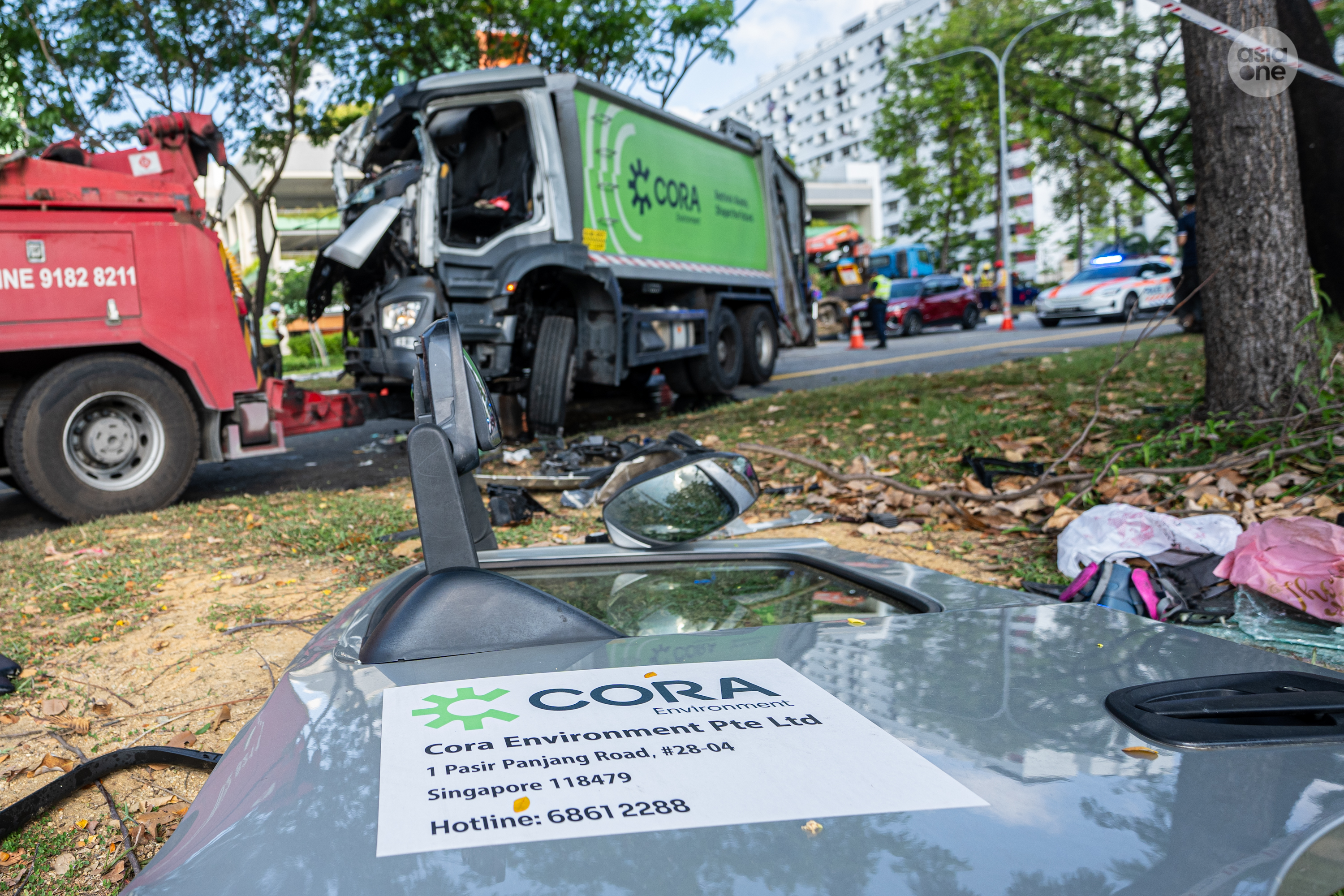SCDF personnel deployed hydraulic equipment to extricate the trapped driver from the waste collection truck's badly crushed cabin.