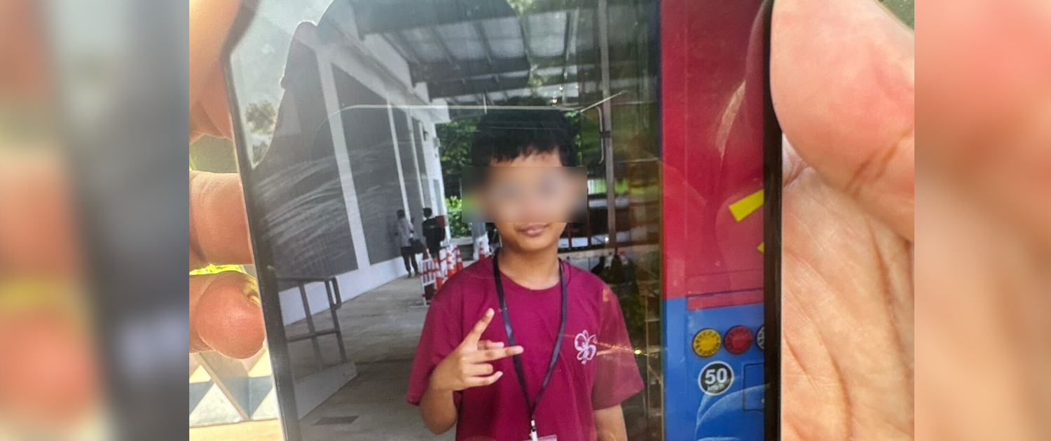 Madam Siti showing AsiaOne a photo of Daniel.