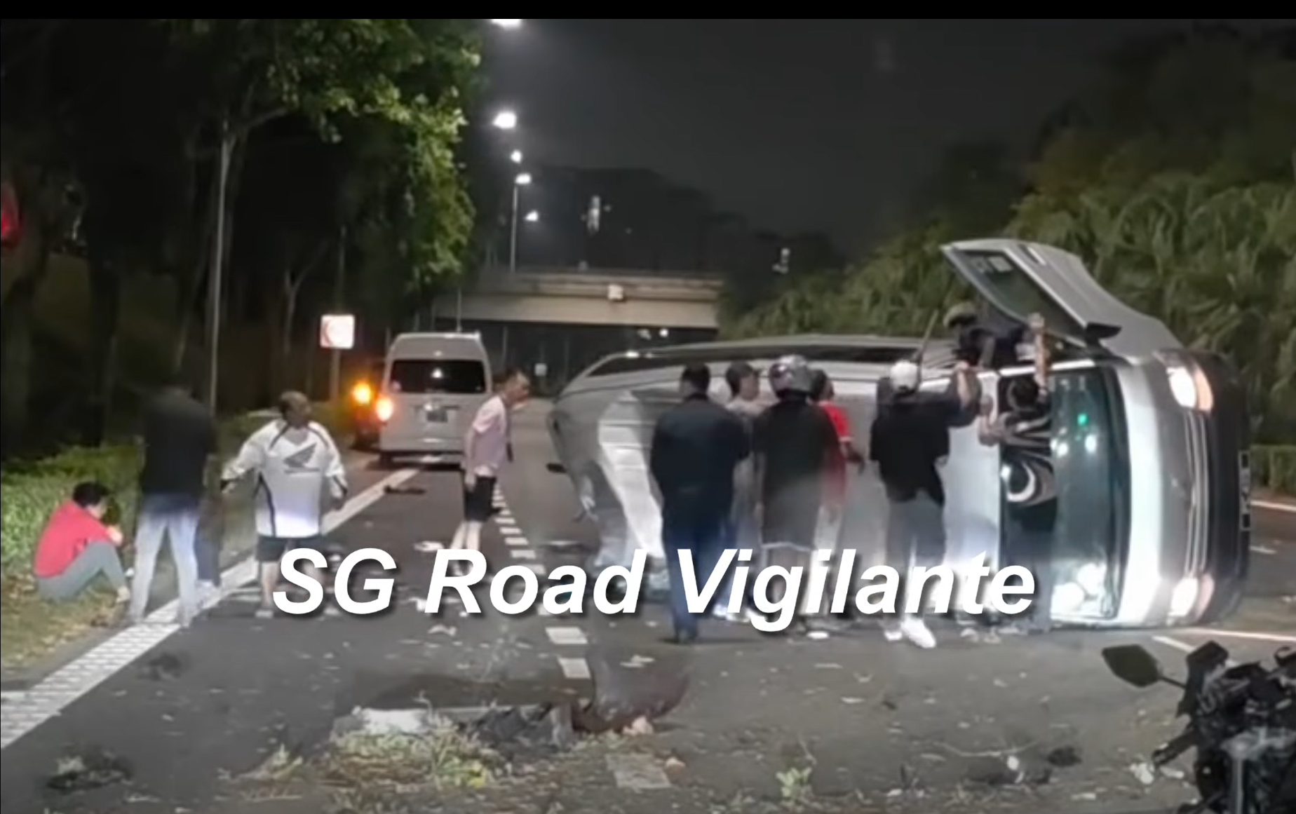 Passing motorists helped the male van driver and his three passengers out of the van.