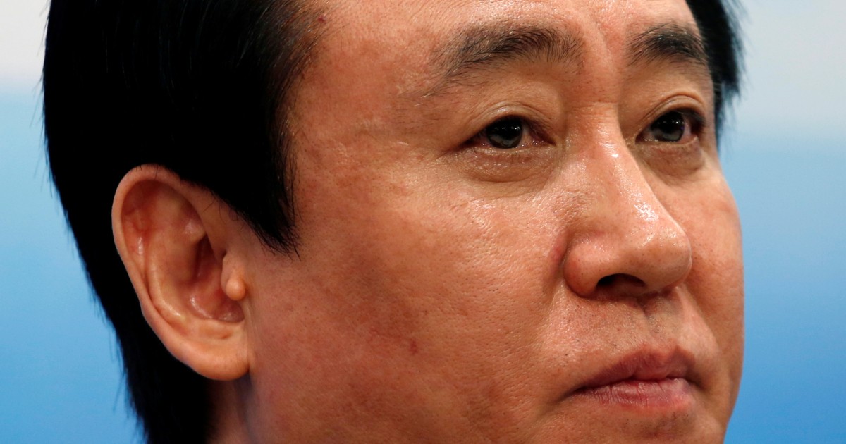 China Evergrande's billionaire boss falls from circles of power to fraud plea