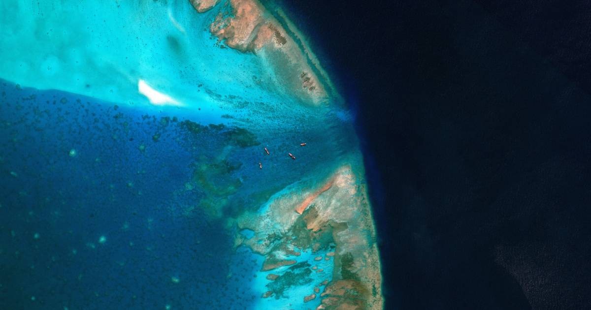 China moves to block entrance to disputed South China Sea shoal, images show