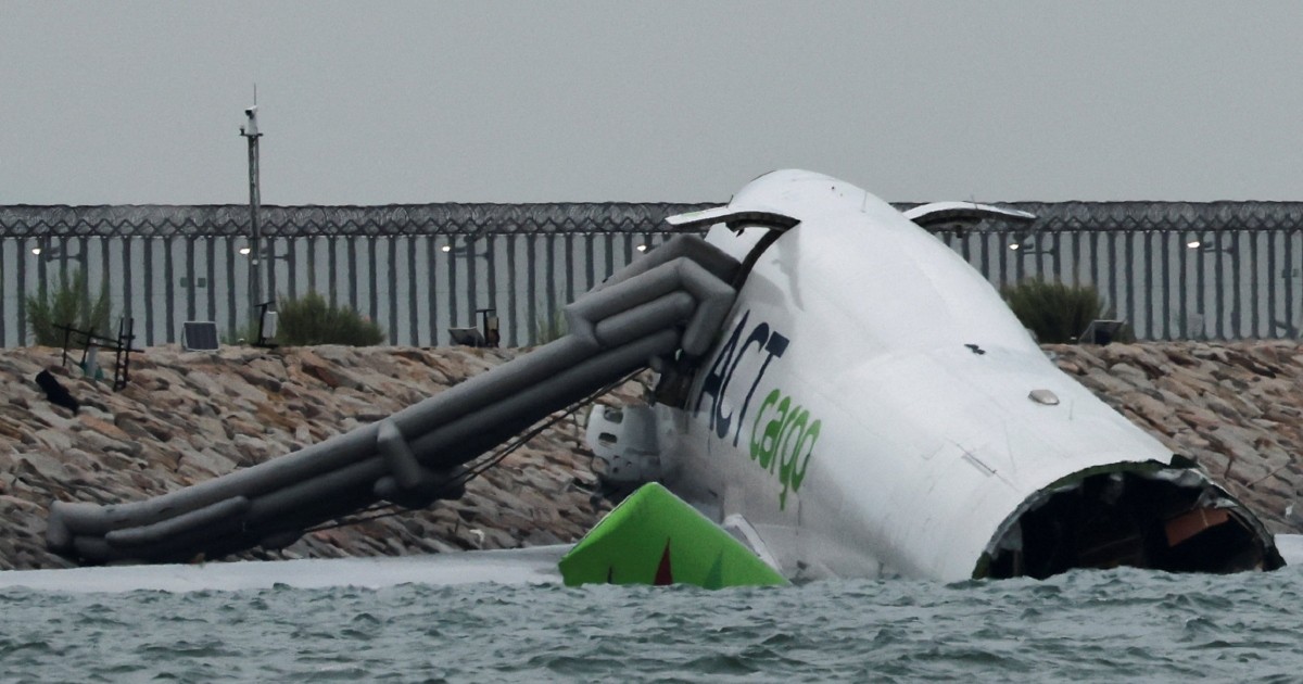 2 reported dead after cargo plane skids off runway into sea at Hong Kong International Airport