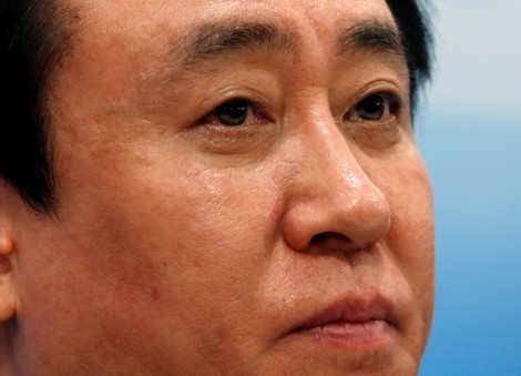 China Evergrande's billionaire boss falls from circles of power to fraud plea