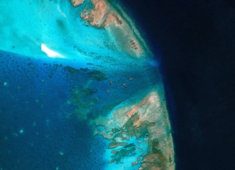 China moves to block entrance to disputed South China Sea shoal, images show